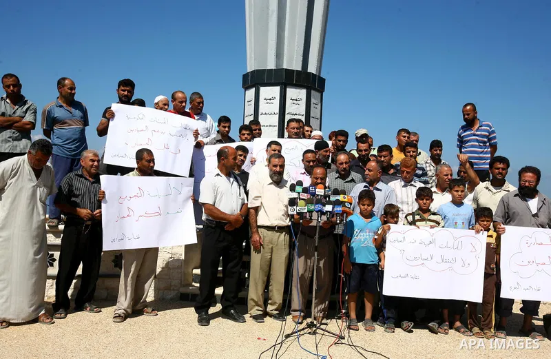 Palestinian fishermen participate in a press conference at the Gaza Seaport on Oct. 5, 2011 against the violations of Israeli forces against the Palestinian fishermen in the Mediterranean Sea. Photo by Majdi Fathi.i