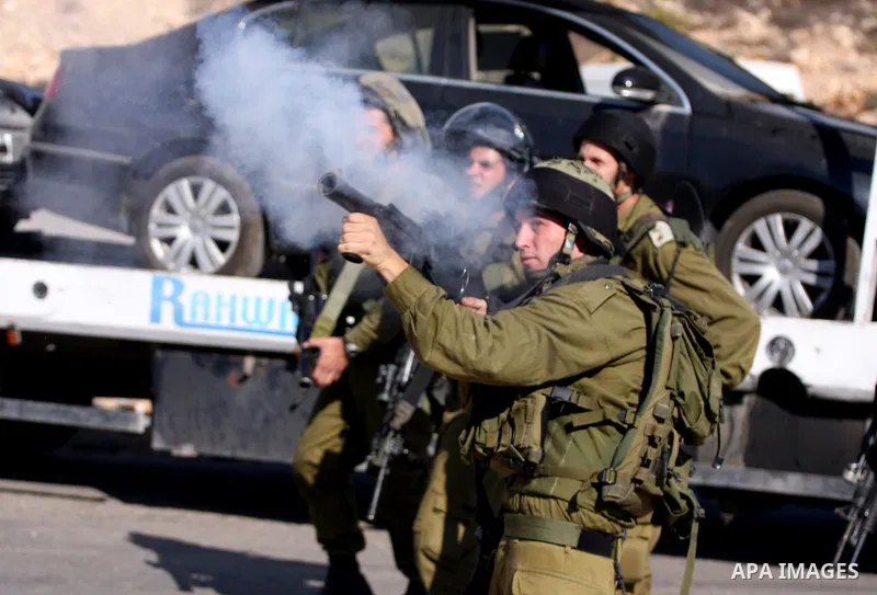Israeli forces clash with Palestinian protestors during a demonstration calling for the release of prisoners held in Israeli jails and in support of inmates in hunger strike, on October 5, 2011 near Israel's Ofer prison,...