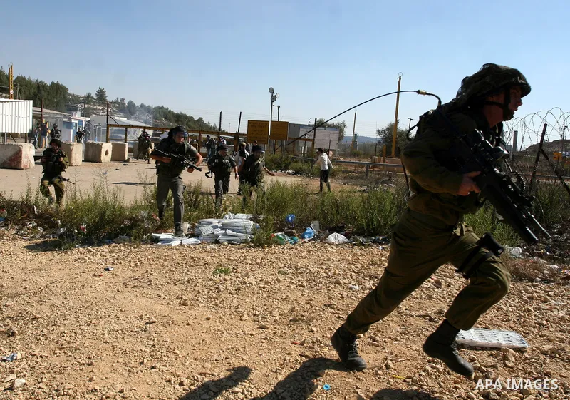Israeli forces clash with Palestinian protestors during a demonstration calling for the release of prisoners held in Israeli jails and in support of inmates in hunger strike, on October 5, 2011 near Israel's Ofer prison,...