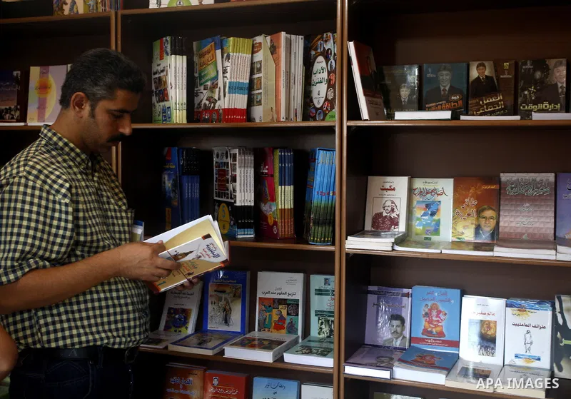 A Palestinian youth searches for books during the opening ceremony of the book exhibition which organised by the Ministry of Culture in Gaza city on Oct. 5,2011. Palestinian Prime Minister in Gaza Strip, Ismail Haniya at...