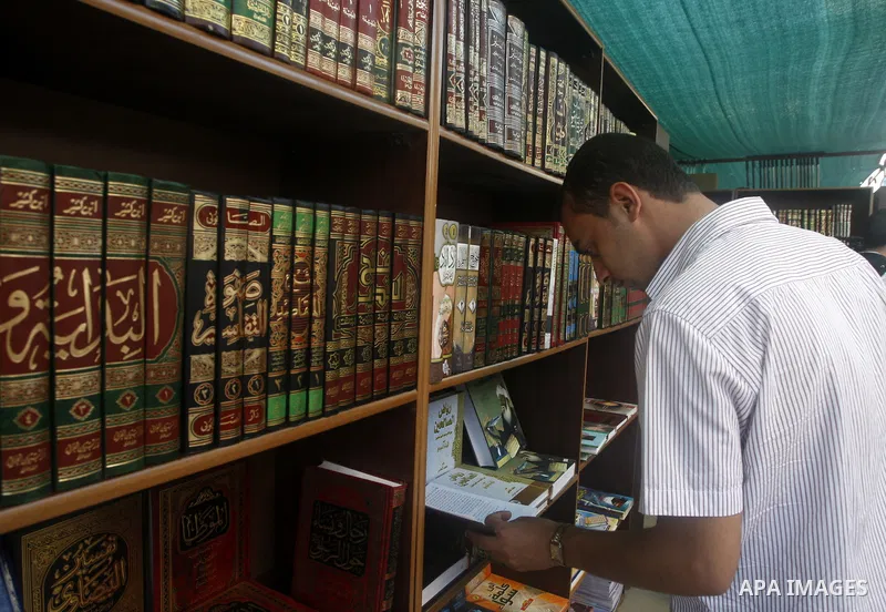 A Palestinian youth searches for books during the opening ceremony of the book exhibition which organised by the Ministry of Culture in Gaza city on Oct. 5,2011. Palestinian Prime Minister in Gaza Strip, Ismail Haniya at...