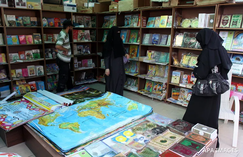 Palestinians search for books during the opening ceremony of the book exhibition which organised by the Ministry of Culture in Gaza city on Oct. 5,2011. Palestinian Prime Minister in Gaza Strip, Ismail Haniya attended th...