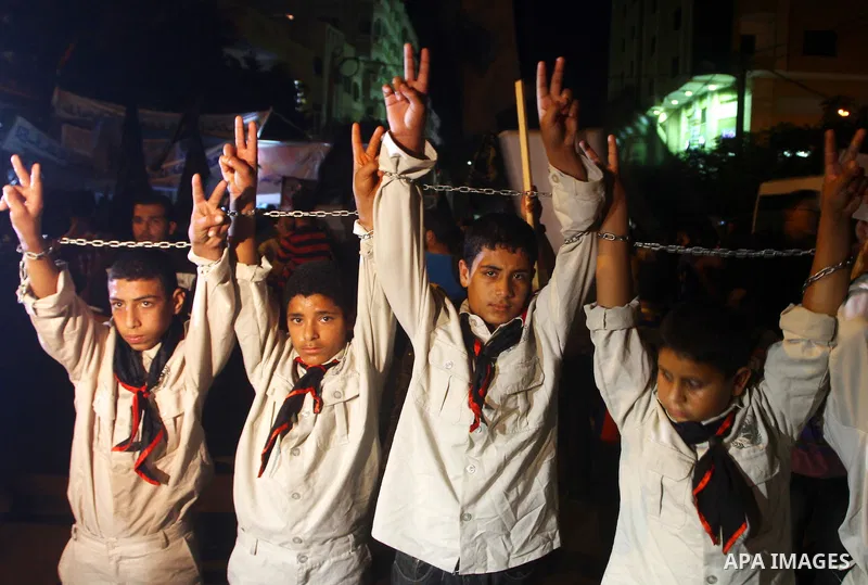 Palestinian Jihad Islamic supporters take part in a protest in Gaza city October 5, 2011, to show their solidarity with Palestinian prisoners held in Israeli jails. Hundreds of Palestinians in Israeli jails have joined a...