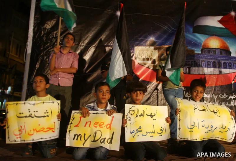 Palestinian Hamas supporters take part in a protest in Gaza city October 5, 2011, to show their solidarity with Palestinian prisoners held in Israeli jails. Hundreds of Palestinians in Israeli jails have joined a hunger...