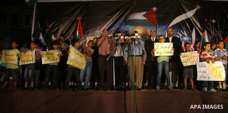 Palestinian Hamas supporters take part in a protest in Gaza city October 5, 2011, to show their solidarity with Palestinian prisoners held in Israeli jails. Hundreds of Palestinians in Israeli jails have joined a hunger...