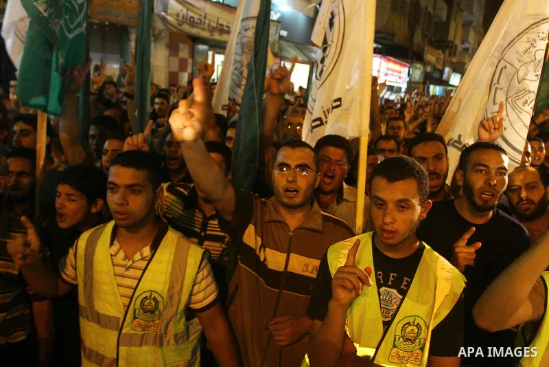 Palestinian Hamas supporters take part in a protest in Gaza city October 5, 2011, to show their solidarity with Palestinian prisoners held in Israeli jails. Hundreds of Palestinians in Israeli jails have joined a hunger...