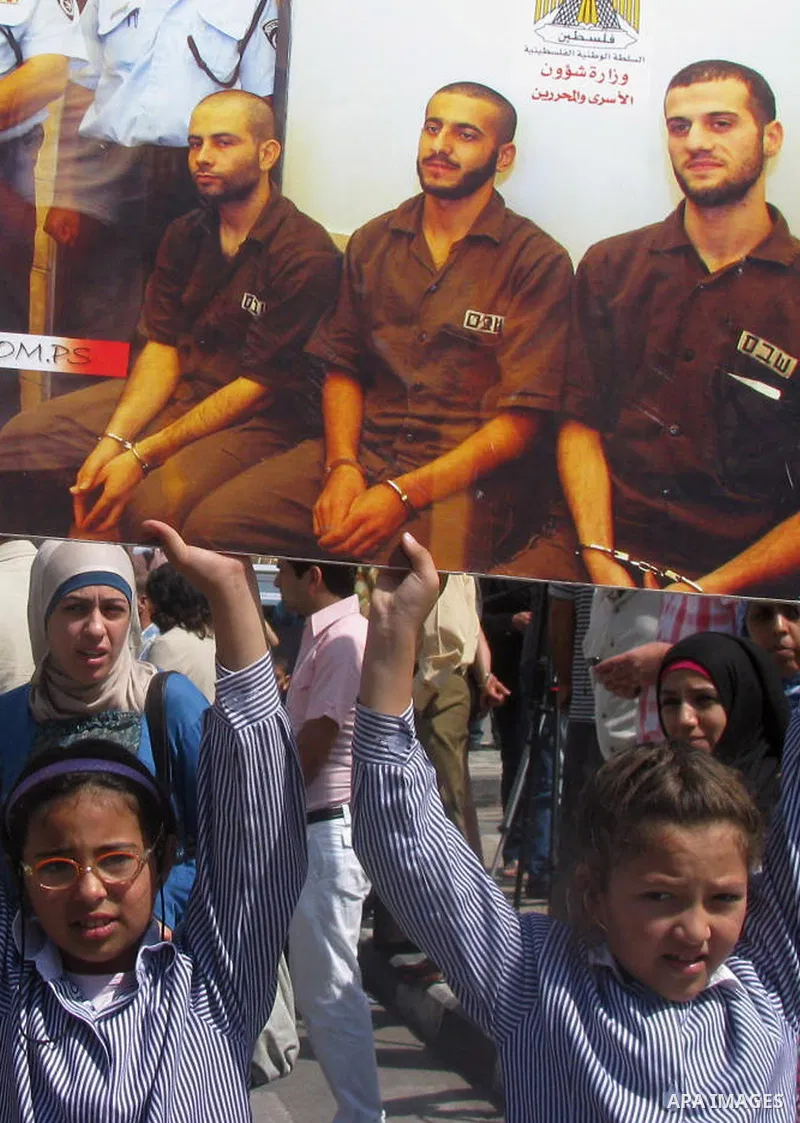 Palestinian children attend a demonstration calling for the release of prisoners held in Israeli jails and in support of inmates in hunger strike, on Oct, 06, 2011 in the West Bank city of Ramallah. Thousands of Palestin...