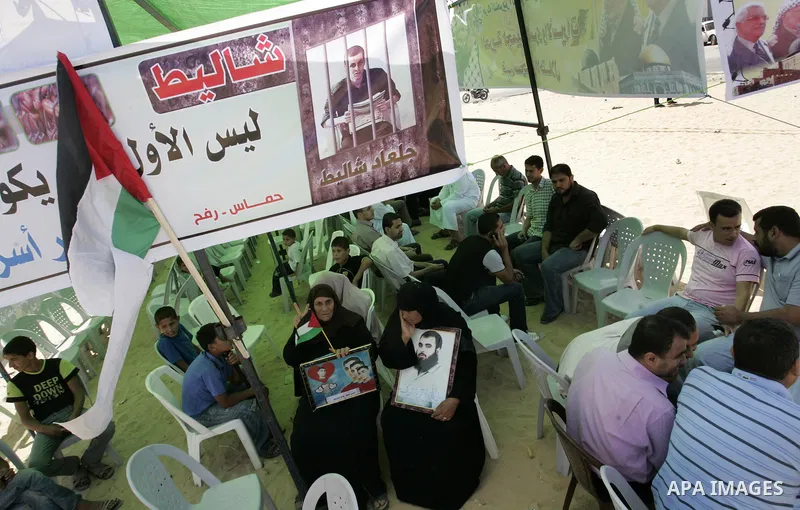 Palestinians take part in a protest in a solidarity tent with prisoners jailed in Israeli in Rafah, southern Gaza Strip on Oct, 6, 2011, to show their solidarity with Palestinian prisoners held in Israeli jails. Hundreds...