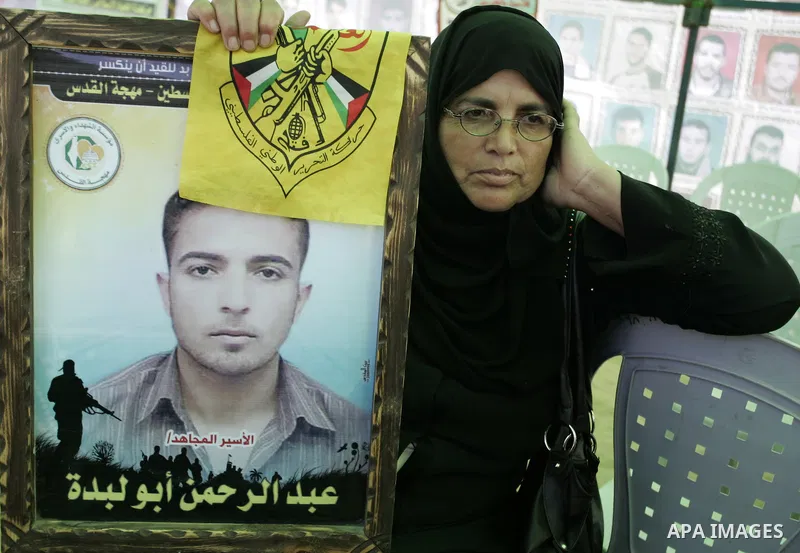 Palestinians take part in a protest in a solidarity tent with prisoners jailed in Israeli in Rafah, southern Gaza Strip on Oct, 6, 2011, to show their solidarity with Palestinian prisoners held in Israeli jails. Hundreds...