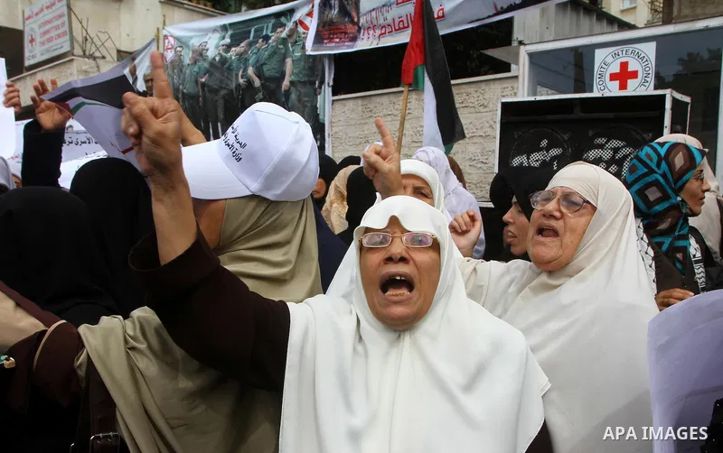 Palestinian women take part in a protest in Gaza City Oct, 06, 2011, to show solidarity with Palestinian prisoners held in Israeli jails. Hundreds of Palestinians in Israeli jails have joined a hunger strike to protest a...