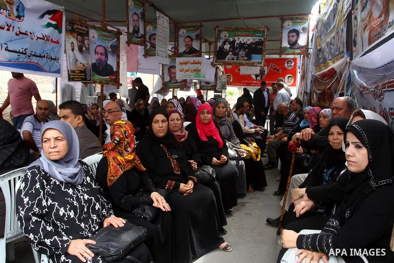 Palestinian women take part in a protest in Gaza City Oct, 06, 2011, to show solidarity with Palestinian prisoners held in Israeli jails. Hundreds of Palestinians in Israeli jails have joined a hunger strike to protest a...