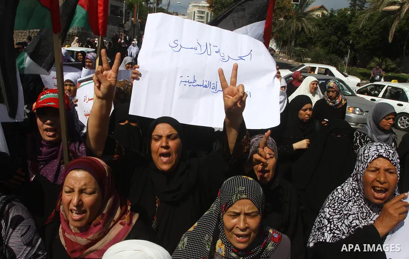 Palestinian women take part in a protest in Gaza City Oct, 06, 2011, to show solidarity with Palestinian prisoners held in Israeli jails. Hundreds of Palestinians in Israeli jails have joined a hunger strike to protest a...