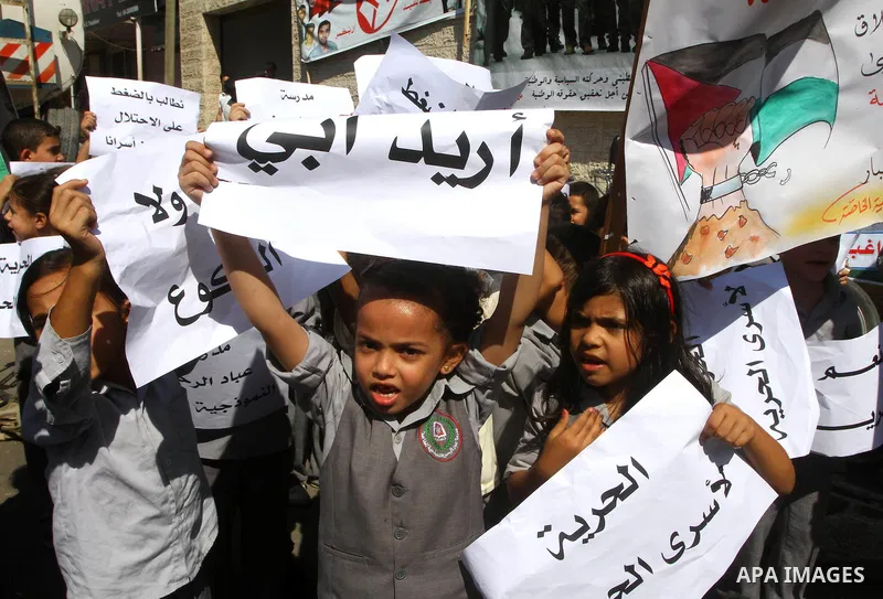 Palestinian women take part in a protest in Gaza City Oct, 06, 2011, to show solidarity with Palestinian prisoners held in Israeli jails. Hundreds of Palestinians in Israeli jails have joined a hunger strike to protest a...