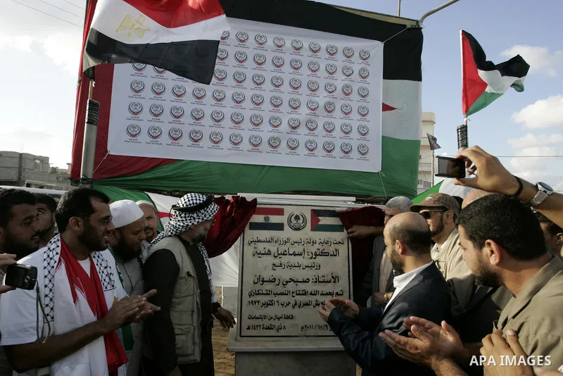 Palestinians and the members of ''Miles of Smiles 6" aid convoy take part in the opening ceremony of the memorial for Egyptians who killed during the 6 Arab-Israeli war in 1973 in Rafah, southern Gaza Strip on Oct. 6,201...