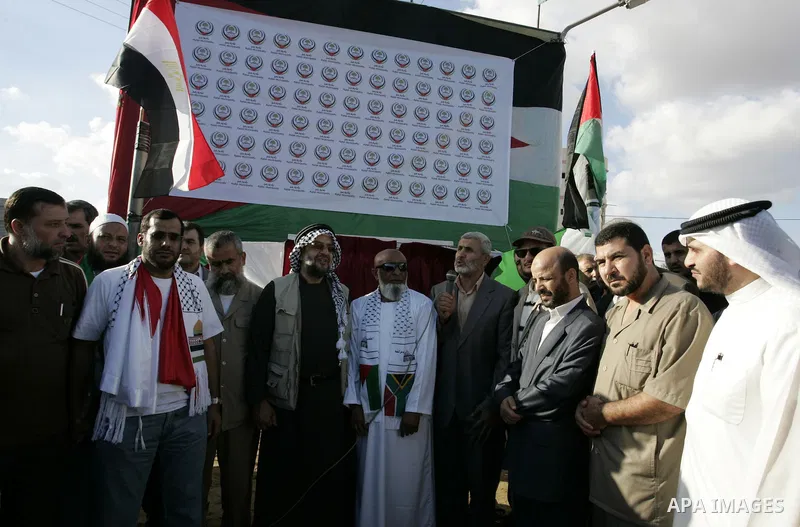 Palestinians and the members of ''Miles of Smiles 6" aid convoy take part in the opening ceremony of the memorial for Egyptians who killed during the 6 Arab-Israeli war in 1973 in Rafah, southern Gaza Strip on Oct. 6,201...