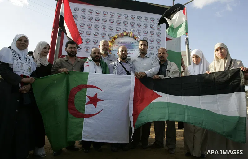 Palestinians and the members of ''Miles of Smiles 6" aid convoy take part in the opening ceremony of the memorial for Egyptians who killed during the 6 Arab-Israeli war in 1973 in Rafah, southern Gaza Strip on Oct. 6,201...