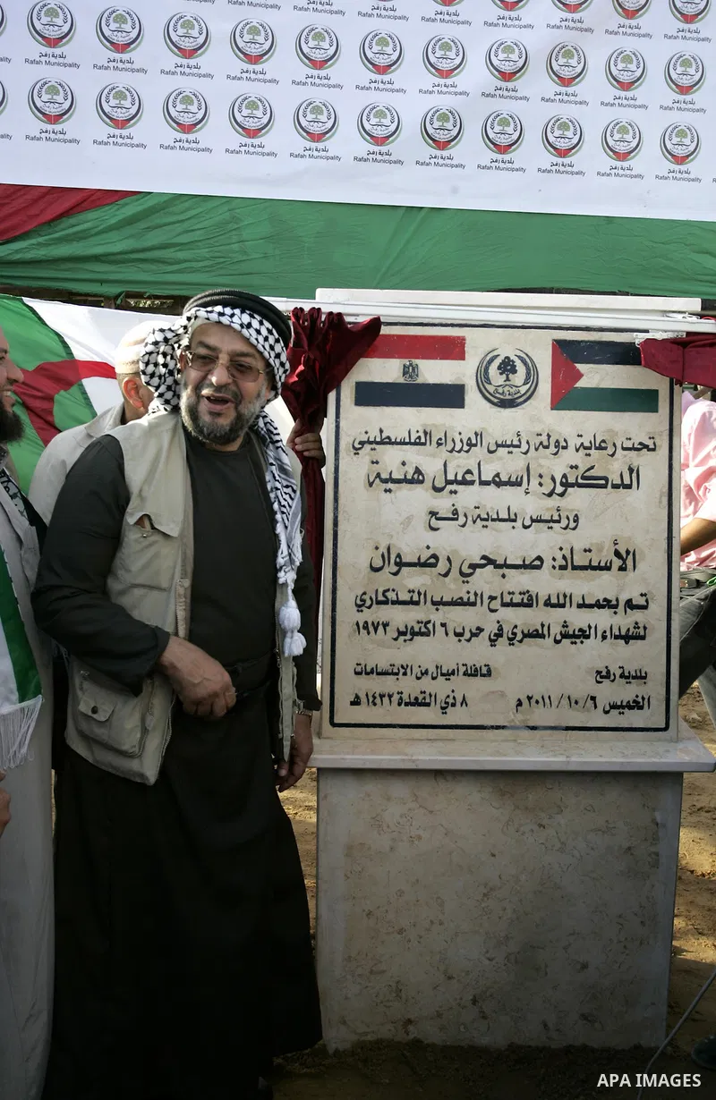 Palestinians and the members of ''Miles of Smiles 6" aid convoy take part in the opening ceremony of the memorial for Egyptians who killed during the 6 Arab-Israeli war in 1973 in Rafah, southern Gaza Strip on Oct. 6,201...