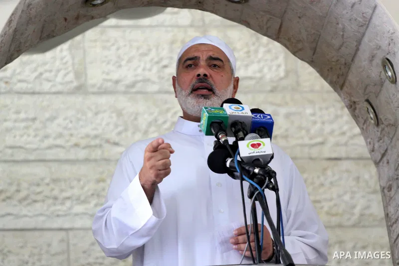 Palestinian Prime Minister in Gaza Strip, Ismail Haniya attends Friday prayers with the members of ''Miles of Smiles 6" aid convoy in Gaza city on Oct. 7,2011. Photo by Mohammed Asad