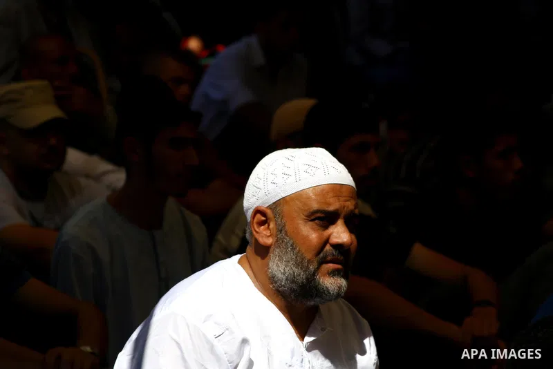 Palestinian Muslim worshippers attend Friday prayer next to the Red Cross building in Gaza City as they call for the release of Palestinian prisoners from Israeli jails and support of inmates in hunger strike on October...