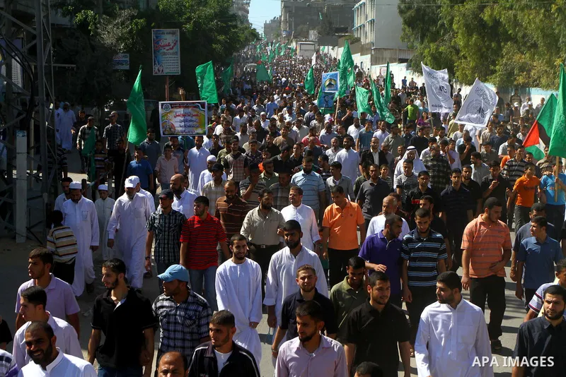 Palestinian Hamas supporters take part in a rally in Jabalya, northern Gaza Strip October 7, 2011, to show solidarity with Palestinian prisoners held in Israeli jails. Hundreds of Palestinians in Israeli jails have joine...