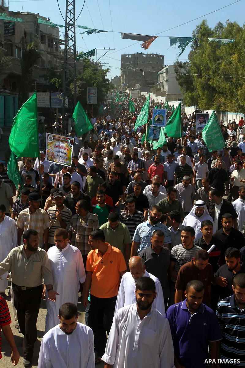 Palestinian Hamas supporters take part in a rally in Jabalya, northern Gaza Strip October 7, 2011, to show solidarity with Palestinian prisoners held in Israeli jails. Hundreds of Palestinians in Israeli jails have joine...