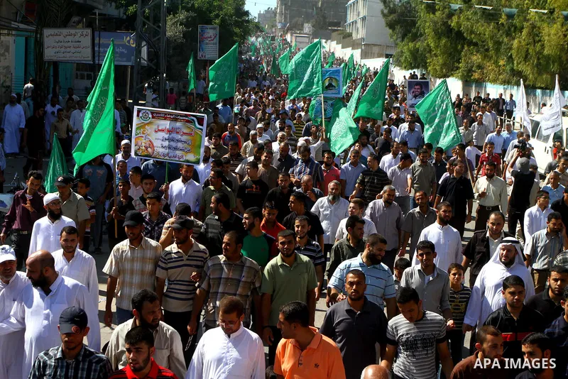Palestinian Hamas supporters take part in a rally in Jabalya, northern Gaza Strip October 7, 2011, to show solidarity with Palestinian prisoners held in Israeli jails. Hundreds of Palestinians in Israeli jails have joine...
