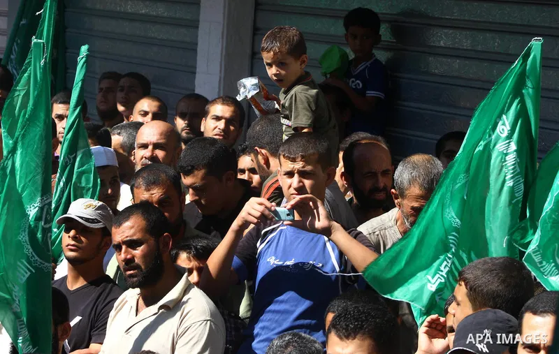 Palestinian Hamas supporters take part in a rally in Jabalya, northern Gaza Strip October 7, 2011, to show solidarity with Palestinian prisoners held in Israeli jails. Hundreds of Palestinians in Israeli jails have joine...