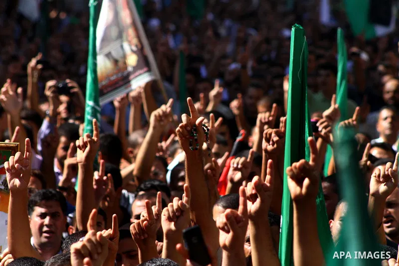 Palestinian Hamas supporters take part in a rally in Jabalya, northern Gaza Strip October 7, 2011, to show solidarity with Palestinian prisoners held in Israeli jails. Hundreds of Palestinians in Israeli jails have joine...