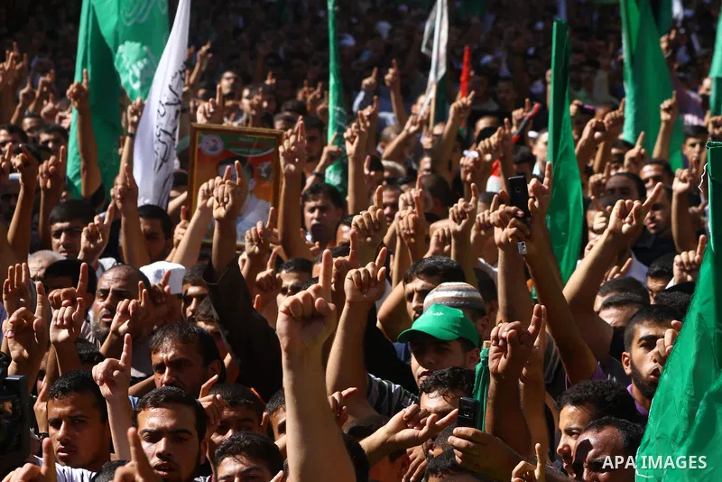 Palestinian Hamas supporters take part in a rally in Jabalya, northern Gaza Strip October 7, 2011, to show solidarity with Palestinian prisoners held in Israeli jails. Hundreds of Palestinians in Israeli jails have joine...