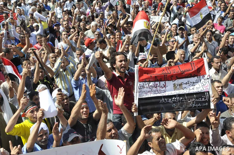 Egyptian demonstrators take part in a weekly protest in Tahrir Square, Cairo, Egypt, Friday, Oct. 7, 2011. Thousands of Egyptians protested Friday against the country's military rulers decision to retain the much hated e...