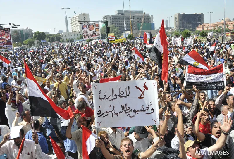 Egyptian demonstrators take part in a weekly protest in Tahrir Square, Cairo, Egypt, Friday, Oct. 7, 2011. Thousands of Egyptians protested Friday against the country's military rulers decision to retain the much hated e...