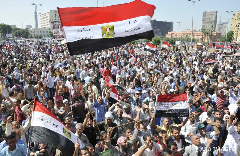 Egyptian demonstrators take part in a weekly protest in Tahrir Square, Cairo, Egypt, Friday, Oct. 7, 2011. Thousands of Egyptians protested Friday against the country's military rulers decision to retain the much hated e...