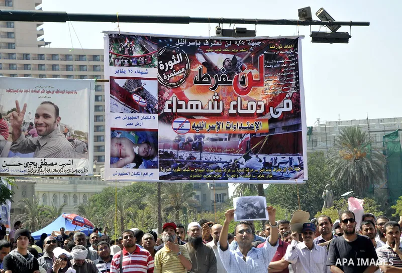Egyptian demonstrators take part in a weekly protest in Tahrir Square, Cairo, Egypt, Friday, Oct. 7, 2011. Thousands of Egyptians protested Friday against the country's military rulers decision to retain the much hated e...