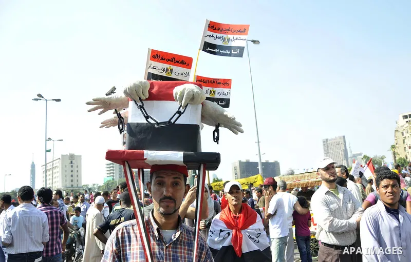 Egyptian demonstrators take part in a weekly protest in Tahrir Square, Cairo, Egypt, Friday, Oct. 7, 2011. Thousands of Egyptians protested Friday against the country's military rulers decision to retain the much hated e...