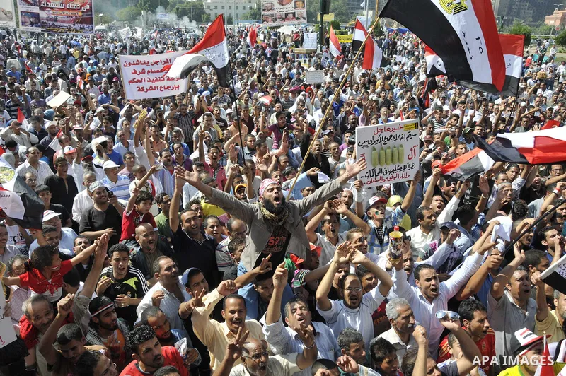 Egyptian demonstrators take part in a weekly protest in Tahrir Square, Cairo, Egypt, Friday, Oct. 7, 2011. Thousands of Egyptians protested Friday against the country's military rulers decision to retain the much hated e...