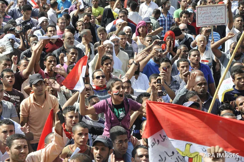 Egyptian demonstrators take part in a weekly protest in Tahrir Square, Cairo, Egypt, Friday, Oct. 7, 2011. Thousands of Egyptians protested Friday against the country's military rulers decision to retain the much hated e...