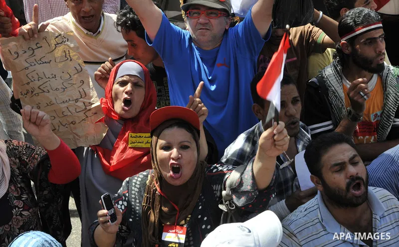 Egyptian demonstrators take part in a weekly protest in Tahrir Square, Cairo, Egypt, Friday, Oct. 7, 2011. Thousands of Egyptians protested Friday against the country's military rulers decision to retain the much hated e...