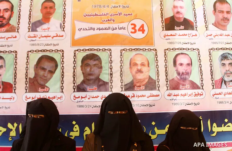 Palestinians take part in a protest in Gaza City Oct, 08, 2011, to show solidarity with Palestinian prisoners held in Israeli jails. Hundreds of Palestinians in Israeli jails have joined a hunger strike to protest agains...