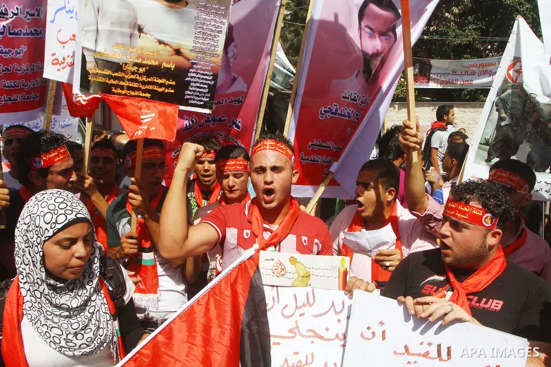 Palestinians shout during a demonstration calling for the release of prisoners from Israeli jails and in support of inmates on a hunger strike, on Oct,09, 2011, in Gaza City. Hundreds of Palestinians in Israeli jails hav...