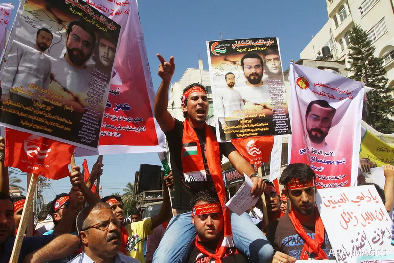 Palestinians shout during a demonstration calling for the release of prisoners from Israeli jails and in support of inmates on a hunger strike, on Oct,09, 2011, in Gaza City. Hundreds of Palestinians in Israeli jails hav...