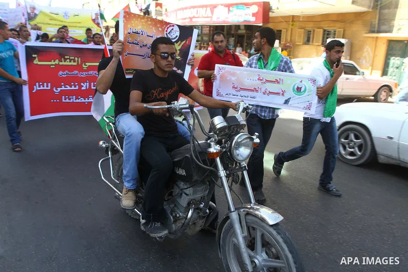 Palestinians shout during a demonstration calling for the release of prisoners from Israeli jails and in support of inmates on a hunger strike, on Oct,09, 2011, in Gaza City. Hundreds of Palestinians in Israeli jails hav...