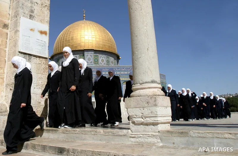 Palestinian schoolgirls walk in front of the Dome of the Rock at Al-Aqsa mosque compound in Jerusalem's old city on Oct. 9,2011. Israel limited access to Jerusalem's Al-Aqsa mosque compound for fear of violence during Yo...