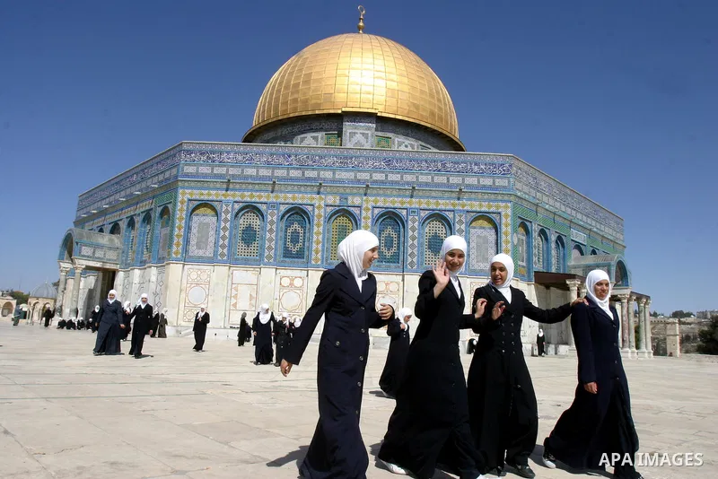 Palestinian schoolgirls walk in front of the Dome of the Rock at Al-Aqsa mosque compound in Jerusalem's old city on Oct. 9,2011. Israel limited access to Jerusalem's Al-Aqsa mosque compound for fear of violence during Yo...