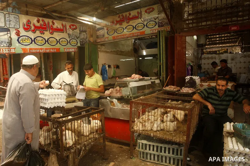 Palestinians shop at the old Fras market in Gaza city on Oct. 9,2011. A Palestinian investor rented Fras from the government in Gaza Strip to establish a large mall instead of the old market which oppose with refuse and...