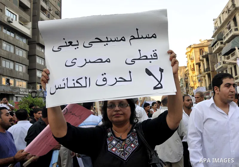 Egyptian Coptic Christians hold crosses and shout slogans, during a protest in Shubra, Cairo, 09 October 2011. According to media report, hundreds of Coptic Christians on 09 October, demonstrated outside the state televi...