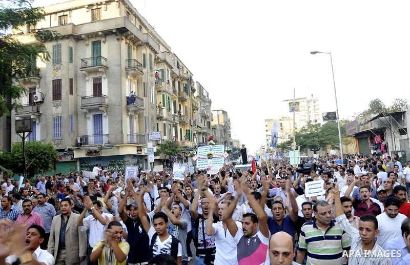 Egyptian Coptic Christians hold crosses and shout slogans, during a protest in Shubra, Cairo, 09 October 2011. According to media report, hundreds of Coptic Christians on 09 October, demonstrated outside the state televi...