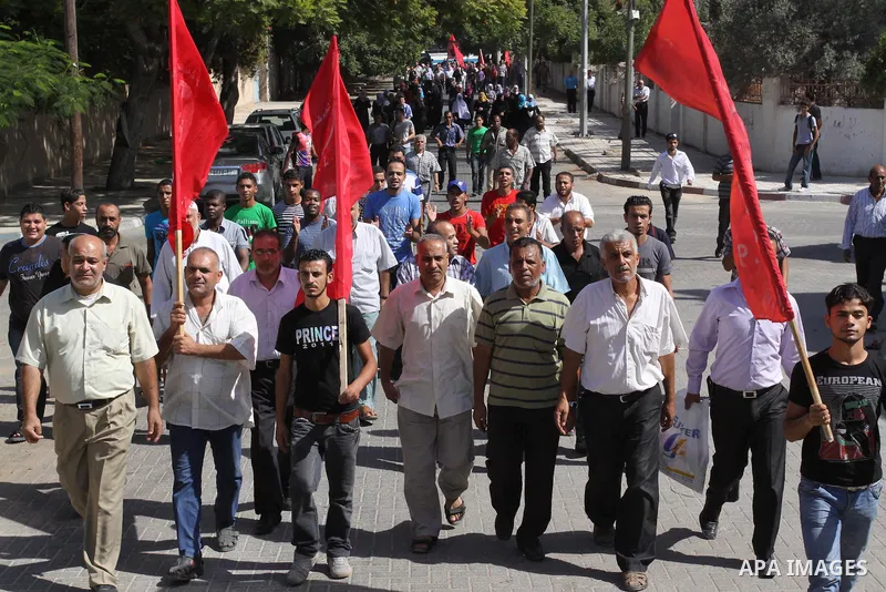 Palestinians protest during a demonstration calling for the release of prisoners from Israeli jails and in support of inmates on a hunger strike, on October 10, 2011, in Gaza City. Hundreds of Palestinians in Israeli jai...