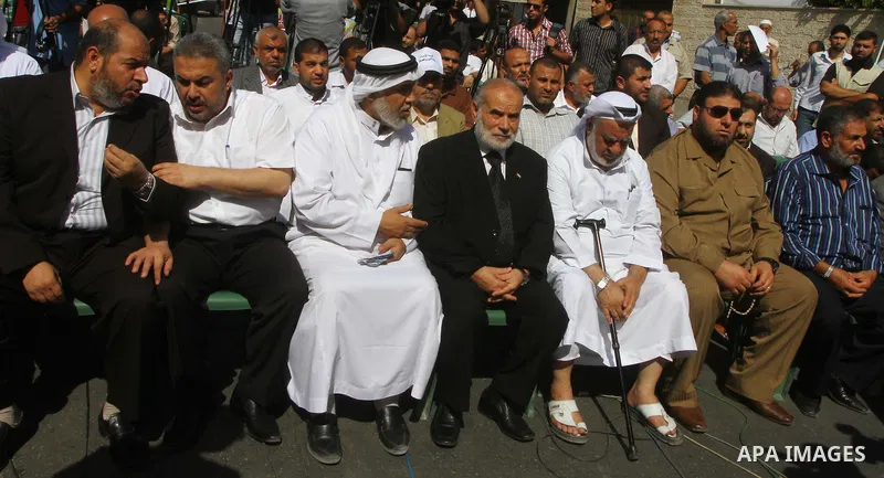 Palestinians take part in a protest in solidarity with Palestinian prisoners held in Israeli jails, in front of the International Red Cross building in Gaza City, Monday, Oct. 10, 2011. Gaza's Hamas rulers have imposed n...