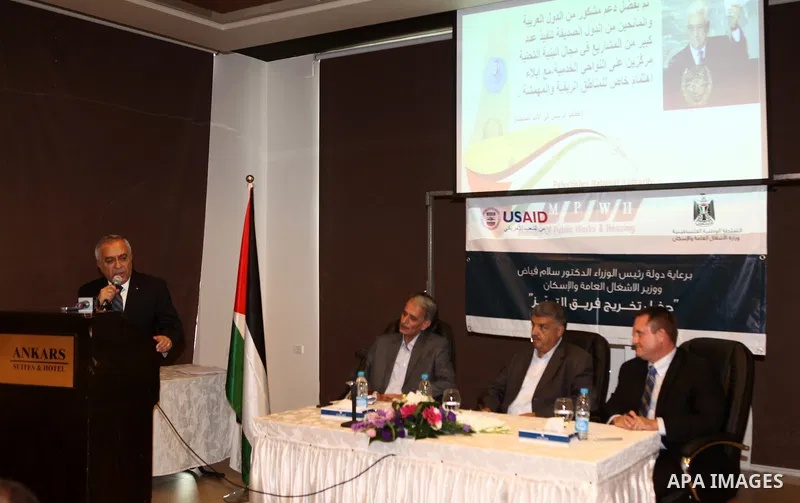 Palestinian prime minister Salam Fayyad attends a celebration to honor the staff of the Ministry of Public Works in the West Bank city of Ramallah, on October 10, 2011. Photo by Mustafa Abu Dayeh