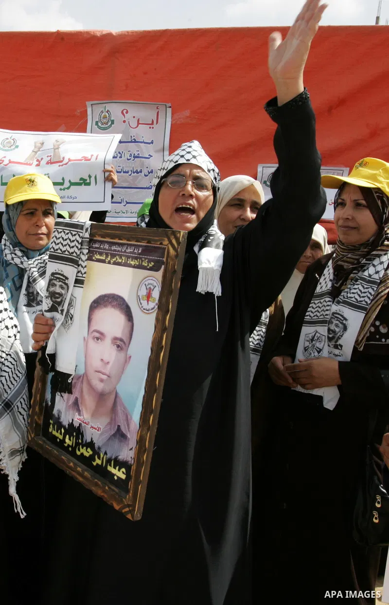 Palestinian women take part in a protest calling for the release of Palestinian prisoners from Israeli jails and in support of inmates in hunger strike on Oct 11, 2011 in Rafah, southern Gaza Strip. Hundreds of Palestini...